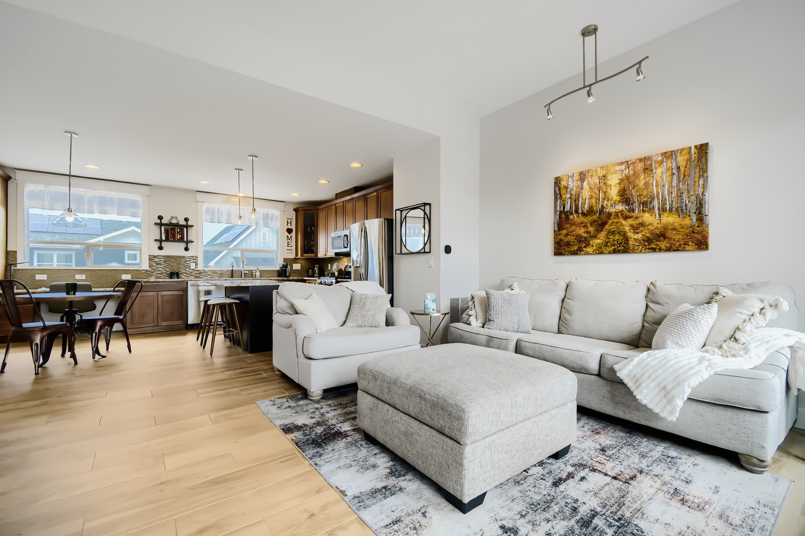 Sink into plush seating after exploring nearby attractions. This open layout connects your living space with a fully-equipped kitchen, making meal prep and relaxation effortless during your getaway.