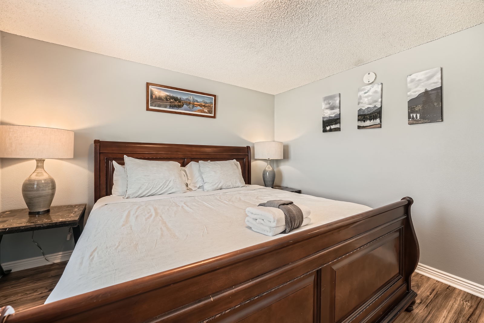 Sink into this comfortable sleigh bed with crisp white linens and fluffy towels waiting for your arrival.