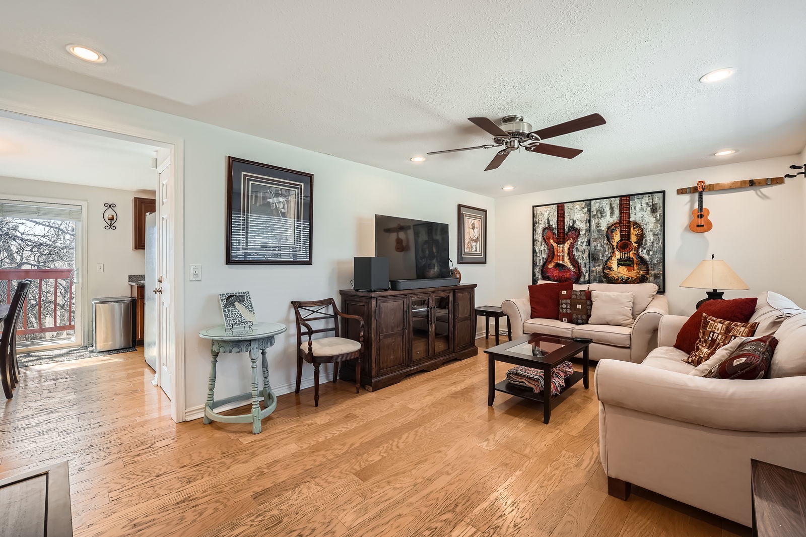 Settle into this stylish living room where music-themed art meets comfortable seating, perfect for relaxing after your daily adventures.