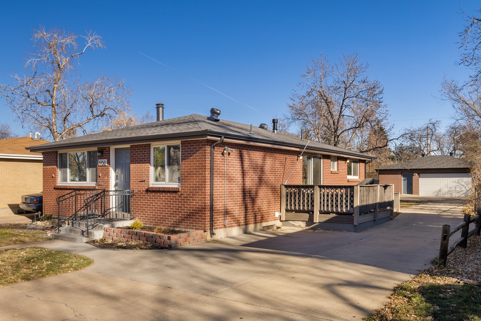 Charming brick ranch home with spacious deck and private driveway in quiet residential neighborhood.