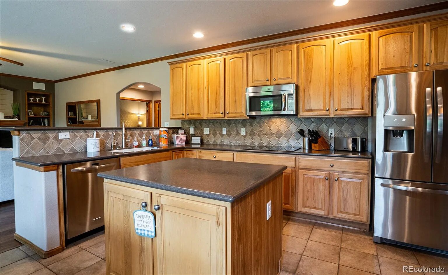 Your gourmet kitchen awaits with rich wood cabinets, granite counters, and full stainless steel appliances for memorable meal preparations.