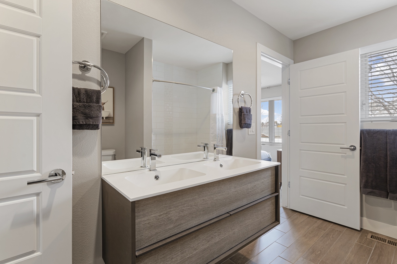 Freshen up at your spacious double vanity with sleek modern fixtures and plenty of storage for all your essentials.