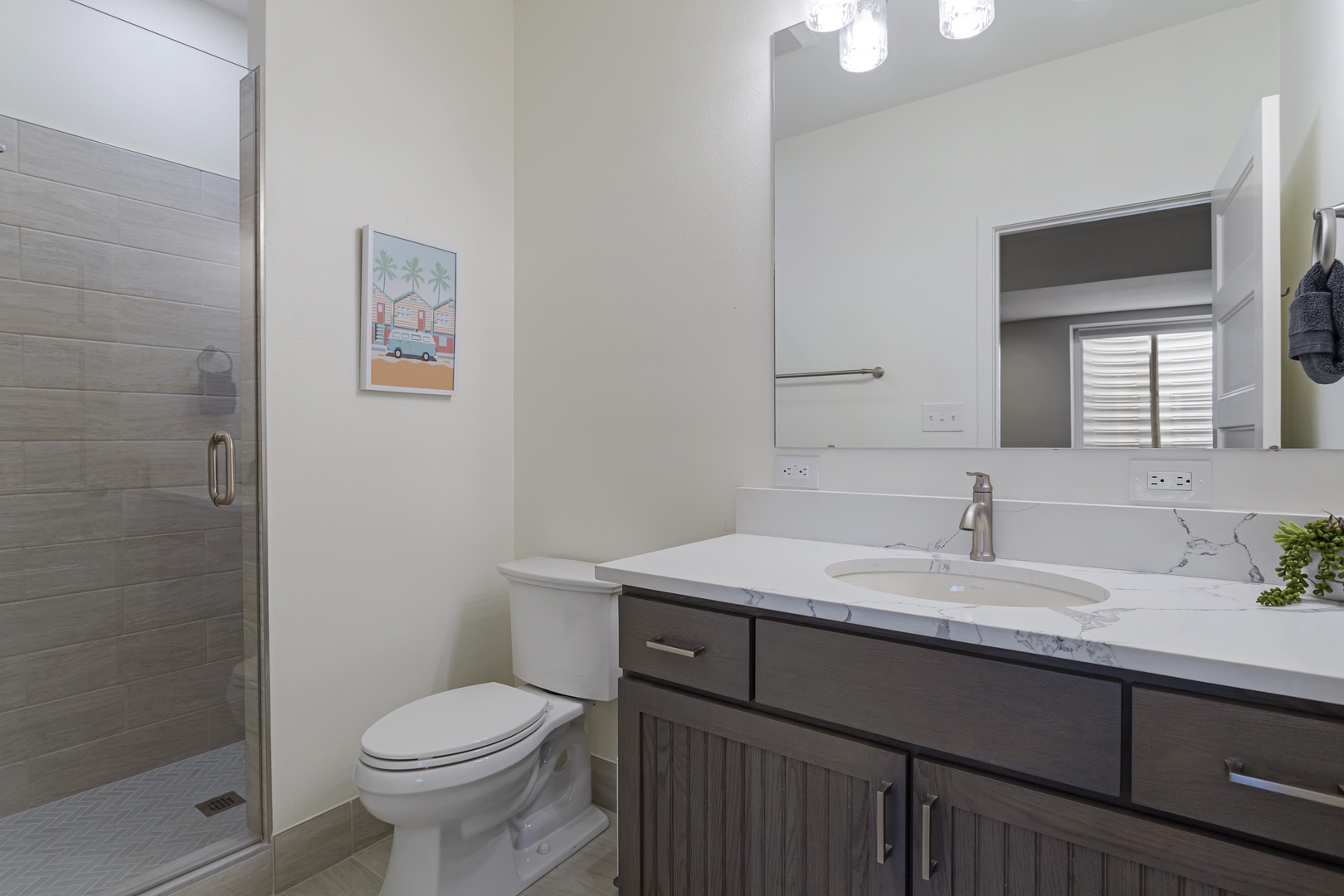 Step into your pristine bathroom with marble countertops, modern fixtures, and a spacious walk-in shower - perfect for refreshing after your adventures.
