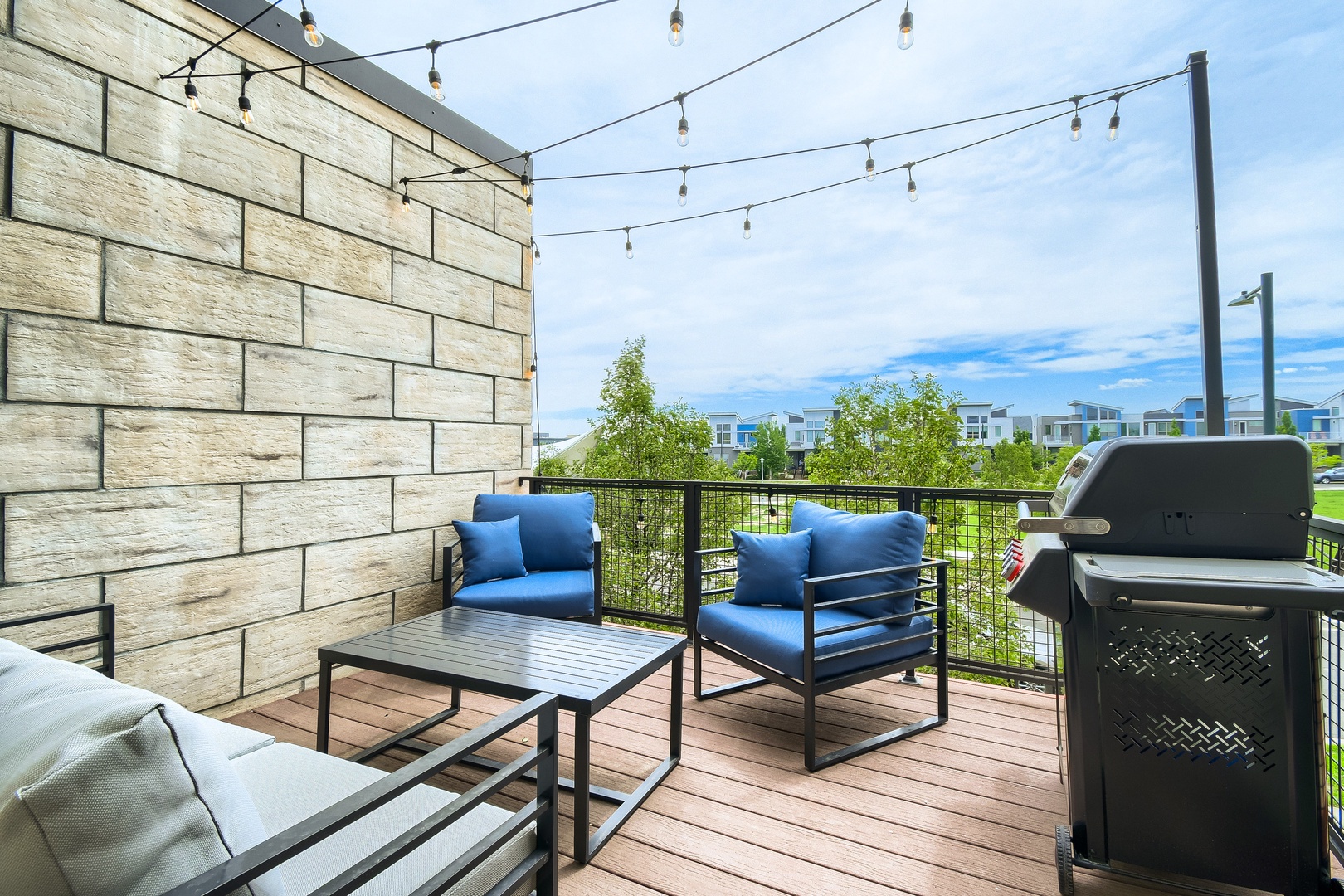 A modern deck with comfortable seating offers your perfect outdoor escape. Fire up the gas grill and relax under string lights as you enjoy views of the surrounding neighborhood.