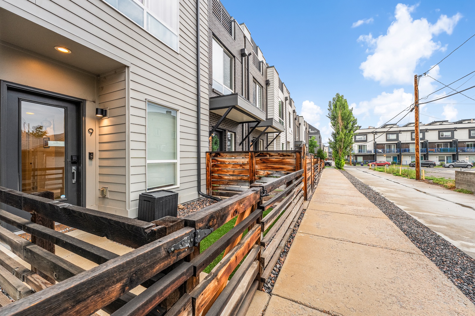Modern townhomes nestled in a friendly residential neighborhood, offering convenient street access and a welcoming urban setting for your stay.