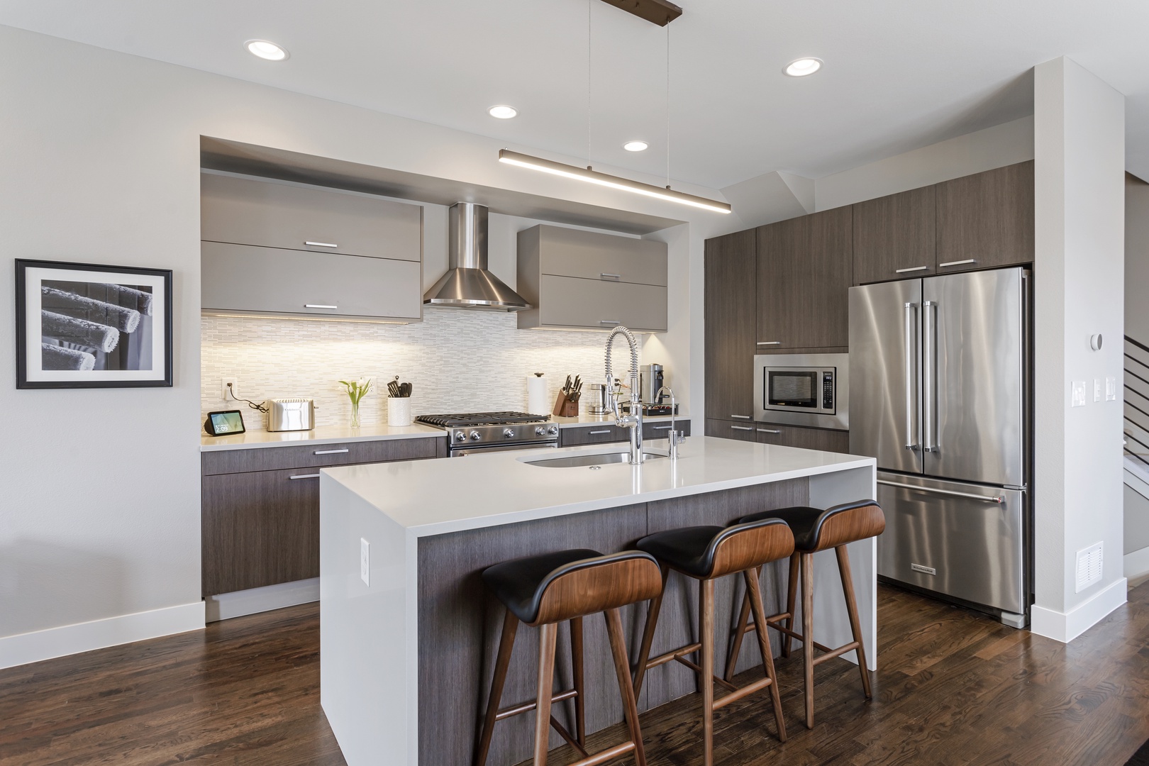 Your sleek modern kitchen features premium appliances, spacious island seating, and everything you need to create memorable meals together.