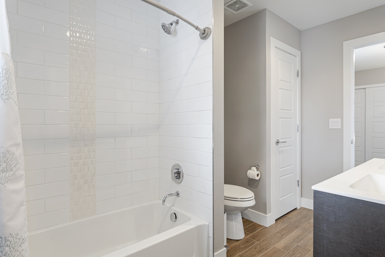 Step into your private spa with a sleek tub-shower combo, perfect for unwinding after exploring the area.