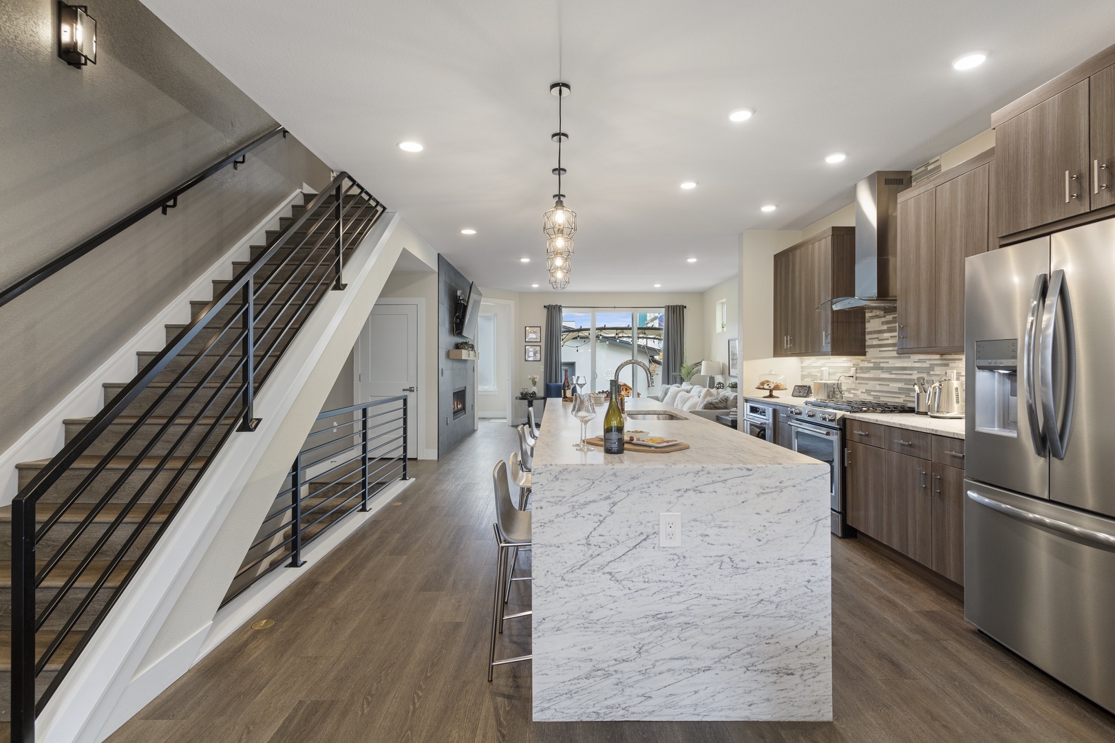 Your gourmet kitchen awaits with marble countertops, stainless steel appliances, and elegant pendant lighting for memorable meal preparations.