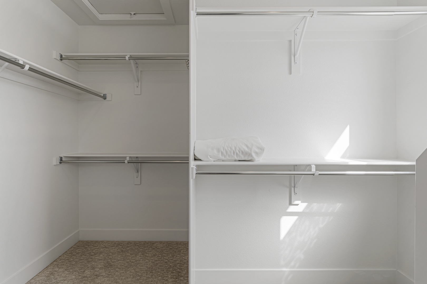 Your spacious walk-in closet offers plenty of room to organize and hang all your belongings during your stay.