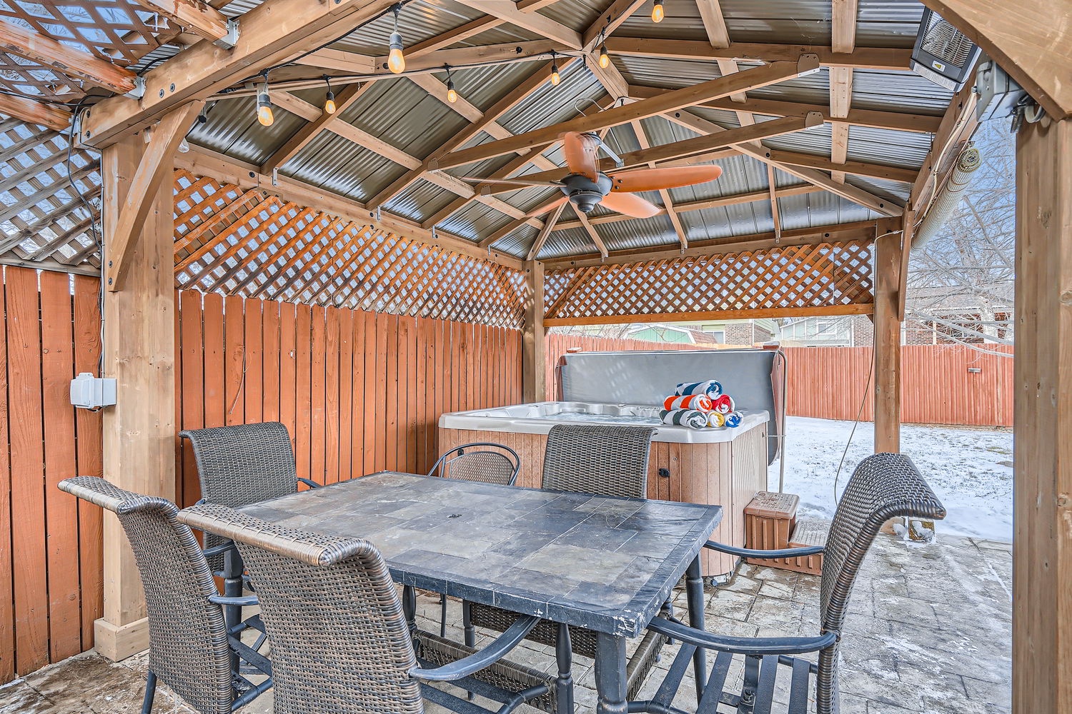 Unwind in your private covered patio space, complete with dining table and hot tub for year-round relaxation. Perfect for morning coffee or evening stargazing.