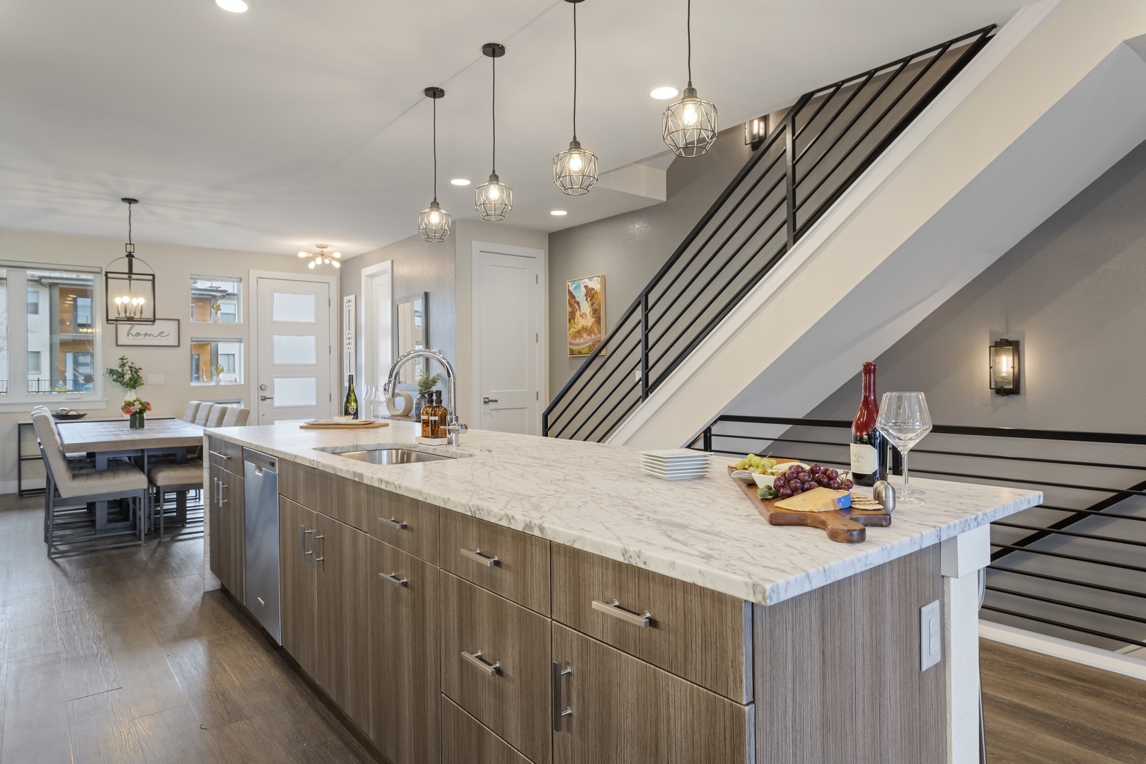 Your gourmet kitchen island becomes the heart of your stay, where marble countertops and modern fixtures invite culinary adventures.