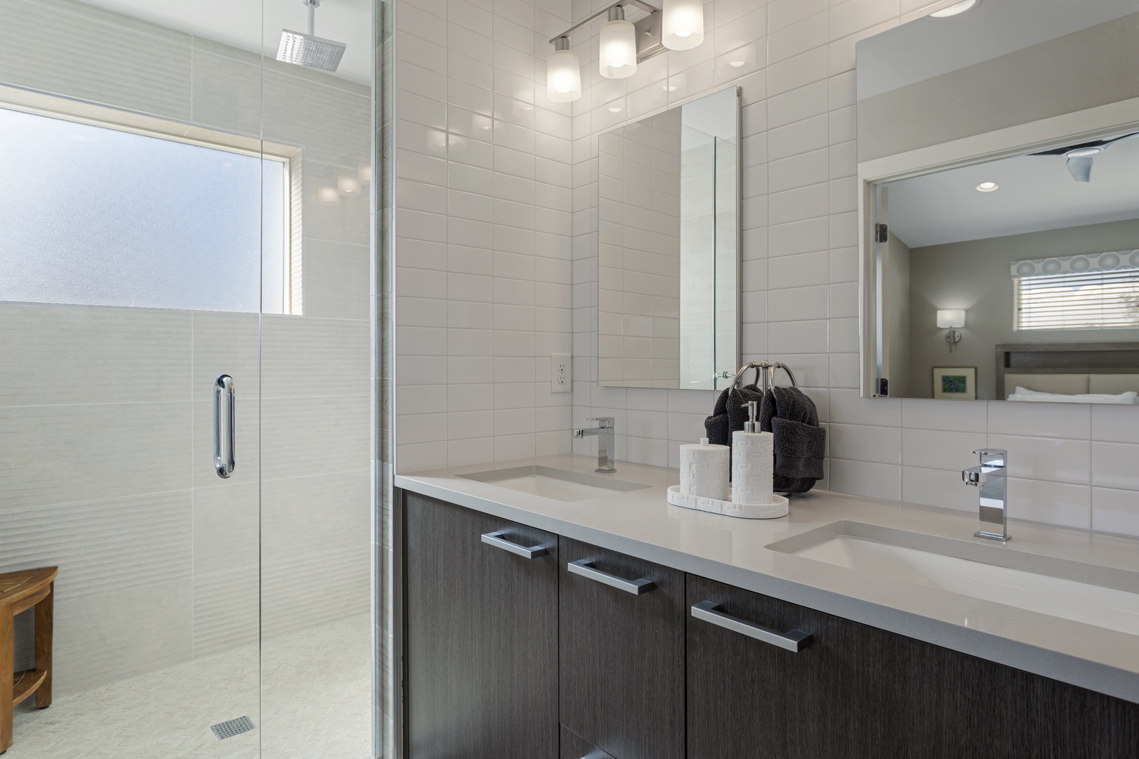 Step into your spa-like ensuite with dual vanities, rainfall shower, and sleek modern finishes for ultimate relaxation.