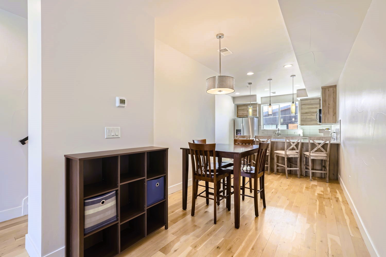 Your open-concept dining space flows seamlessly into the modern kitchen, perfect for sharing meals and making memories together.