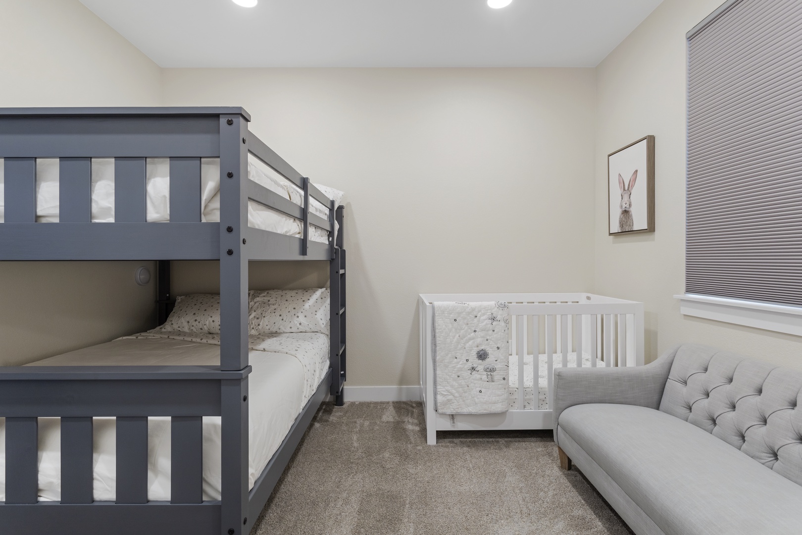 Your family room features cozy bunk beds and a crib, perfect for kids to dream peacefully while you relax nearby.