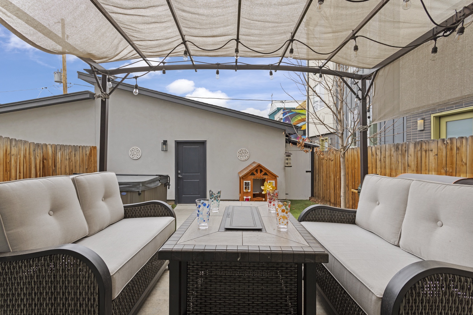 Unwind in your private outdoor oasis with plush seating and a charming pergola creating the perfect spot for morning coffee or evening relaxation.
