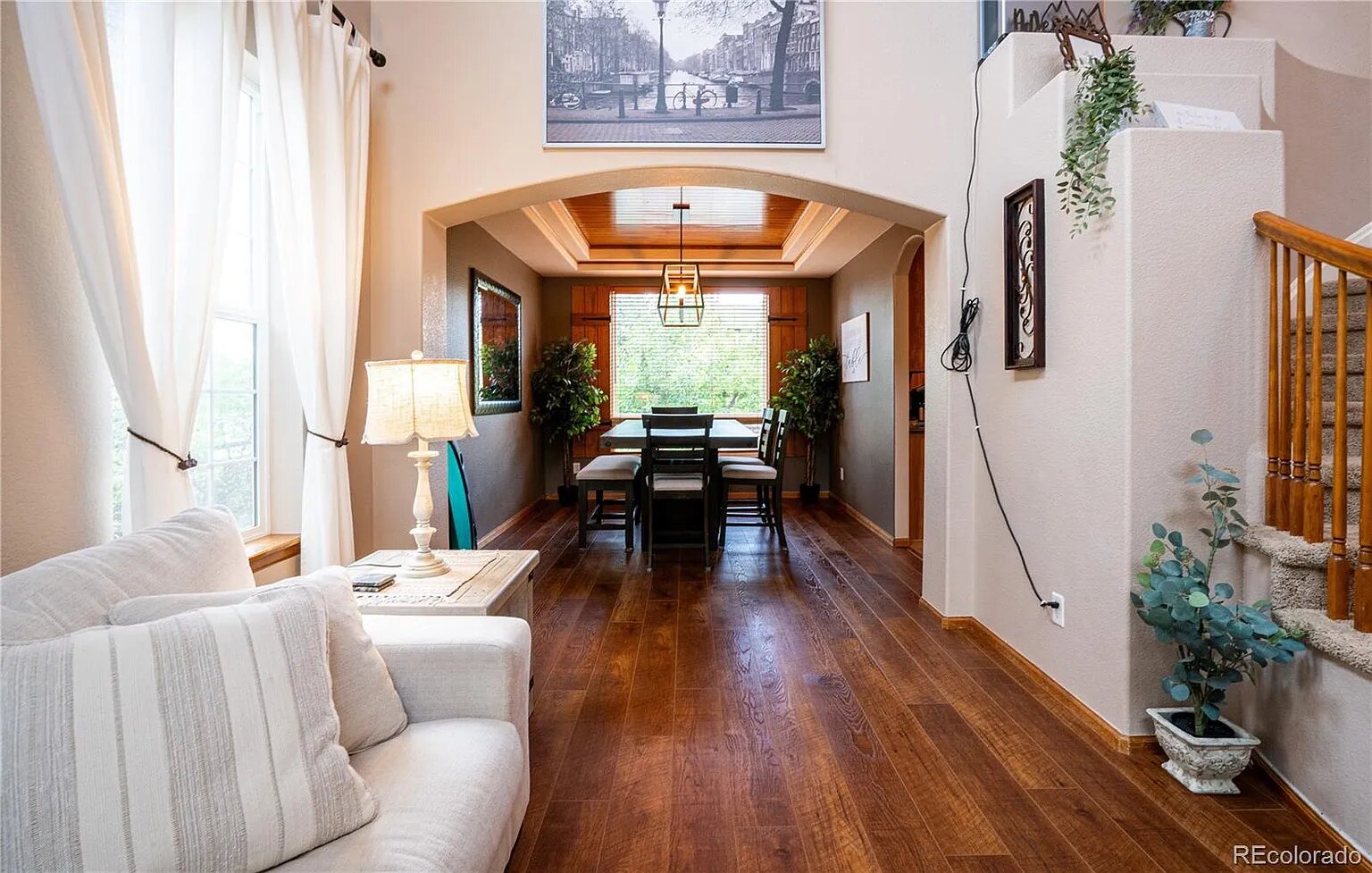 Settle into your cozy living room where rich hardwood floors lead to your elegant dining space, perfect for memorable meals together.