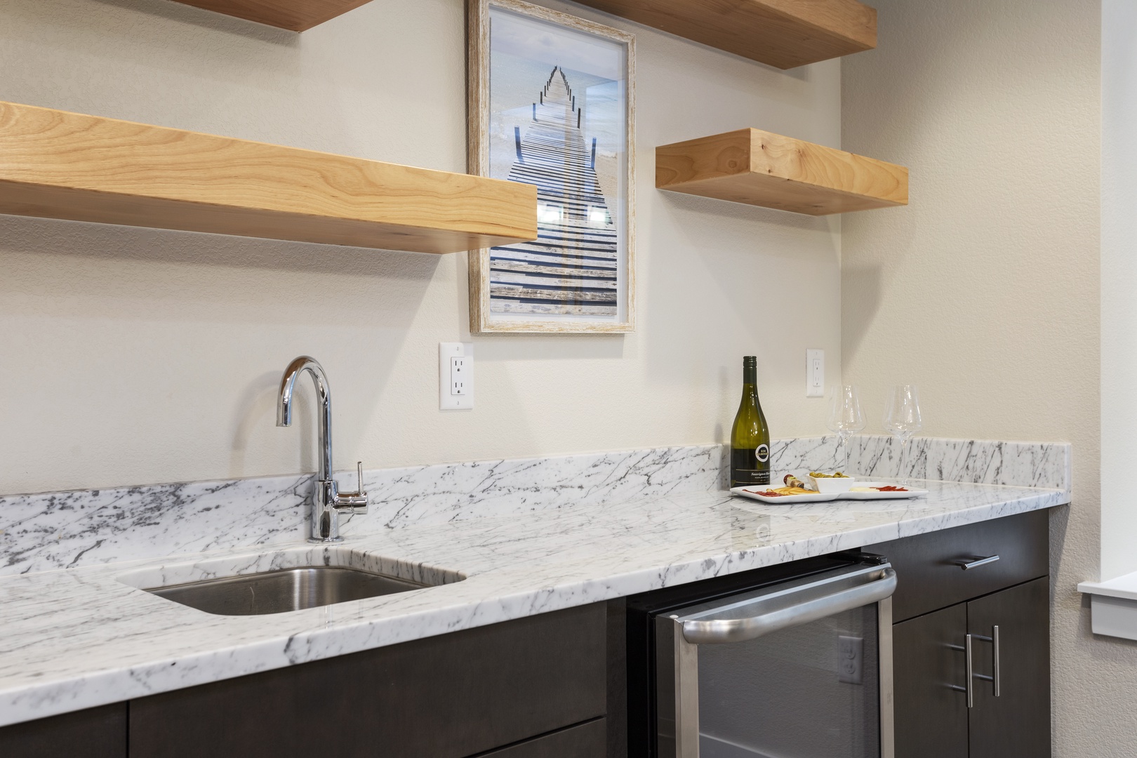 Your sleek kitchenette features marble countertops and modern appliances, perfect for preparing light meals and enjoying wine after exploring.