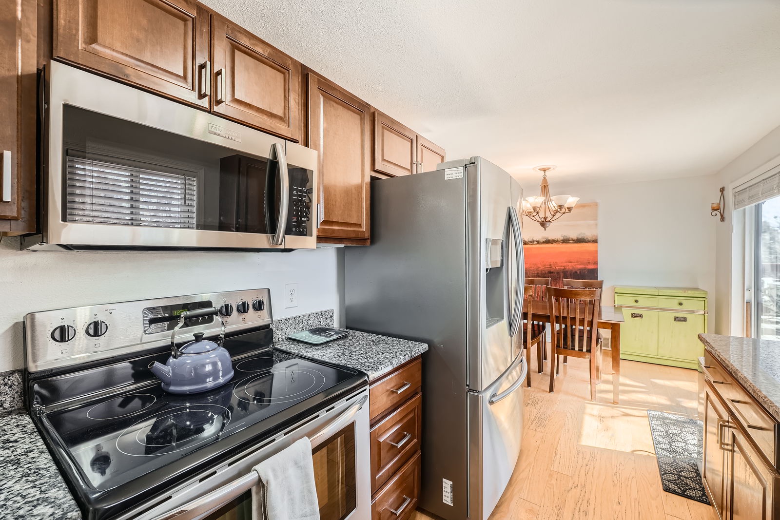 Your fully equipped kitchen features stainless steel appliances and granite countertops, perfect for preparing meals with all the comforts of home.