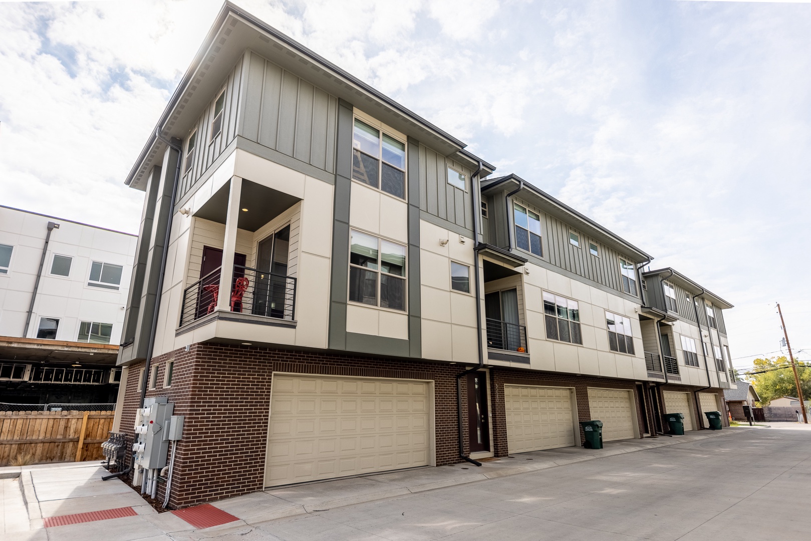 Modern townhomes with spacious garages and private balconies, situated in a quiet residential neighborhood—perfect for your next getaway.