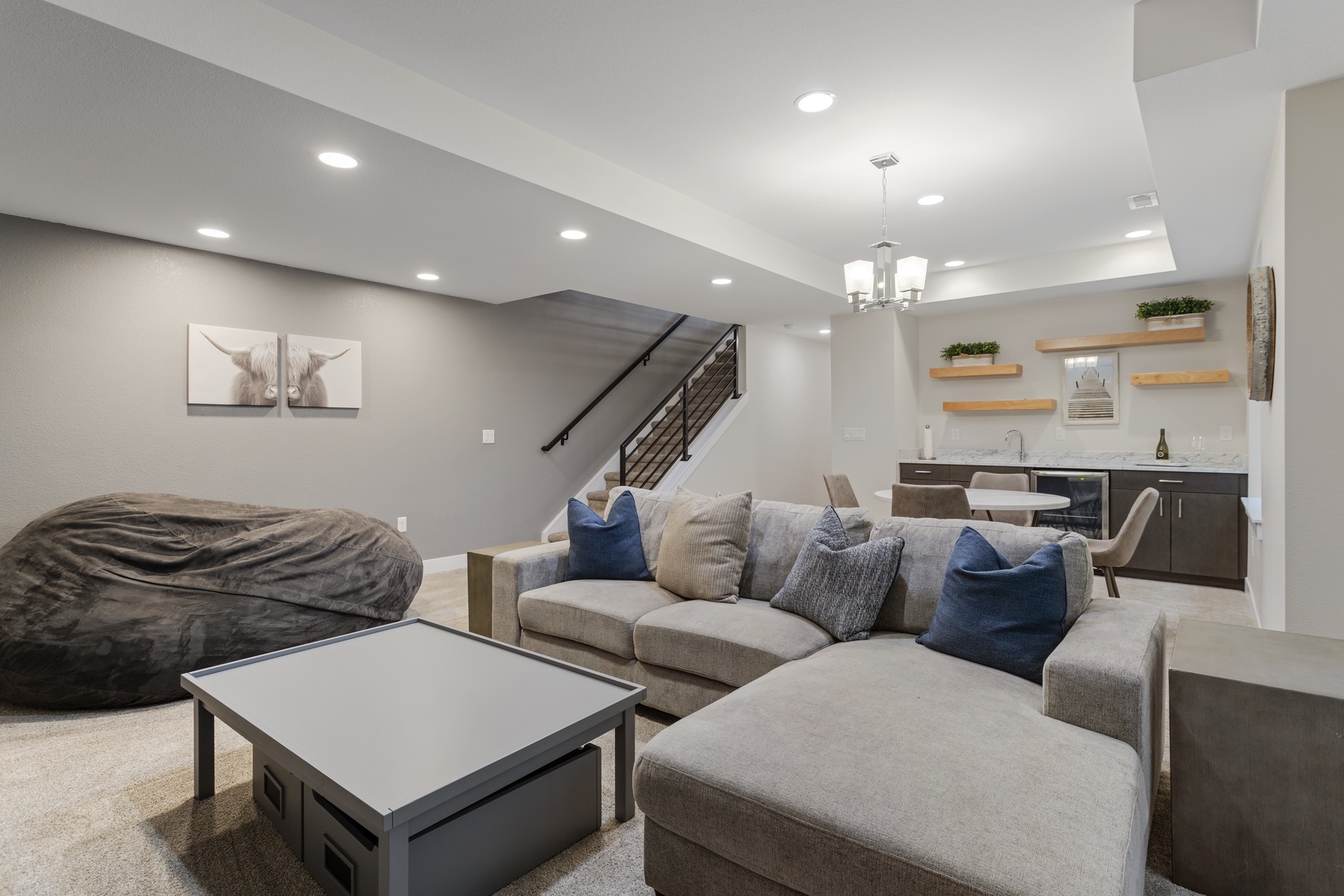 Sink into plush sectional seating in your modern basement retreat, complete with a stylish wet bar for evening relaxation.