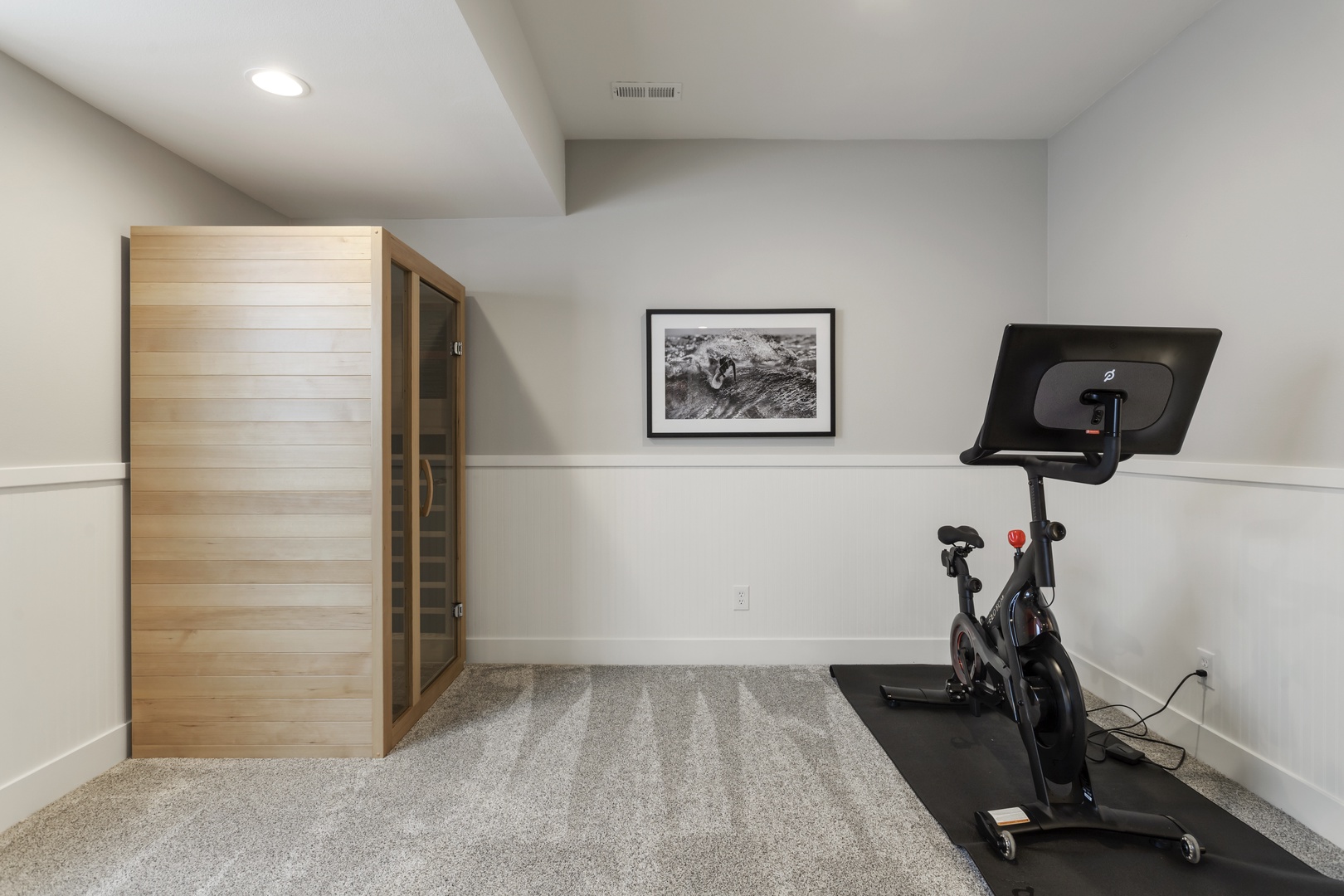 Stay active with your private fitness setup featuring a Peloton bike and relaxing sauna.