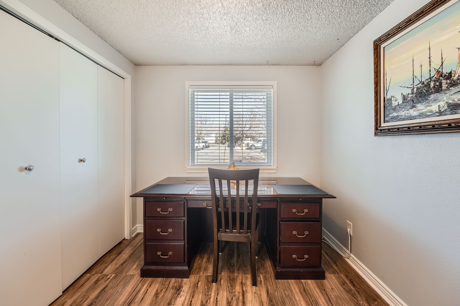 Your private office space features a rich mahogany desk with ample storage, where you can work comfortably by the natural light.