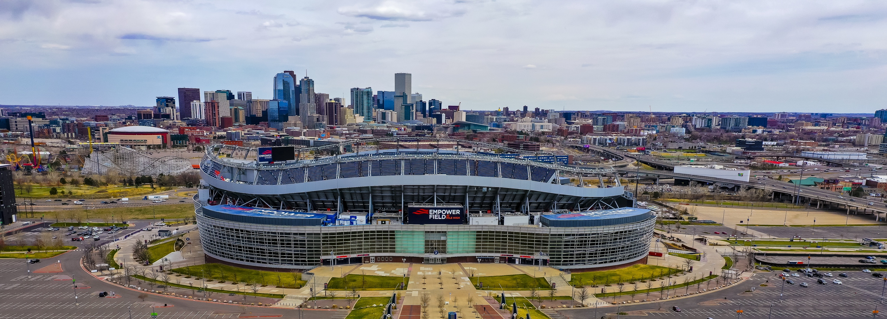Modern stadium stands as a prominent landmark in the downtown area, surrounded by the bustling cityscape and urban development.