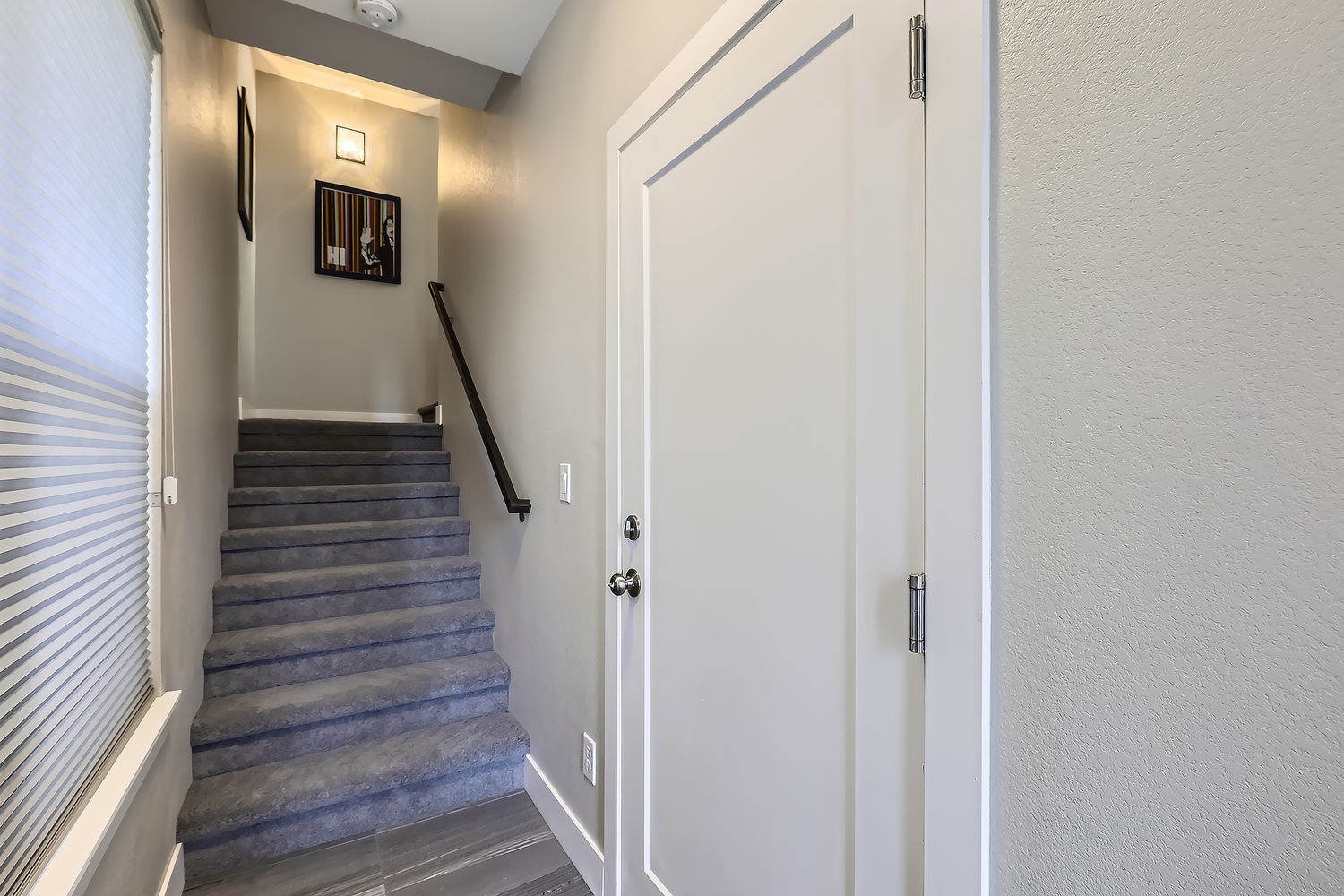 A bright, welcoming entryway with stairs leading to your private retreat. Clean lines and thoughtful touches create a seamless arrival experience.