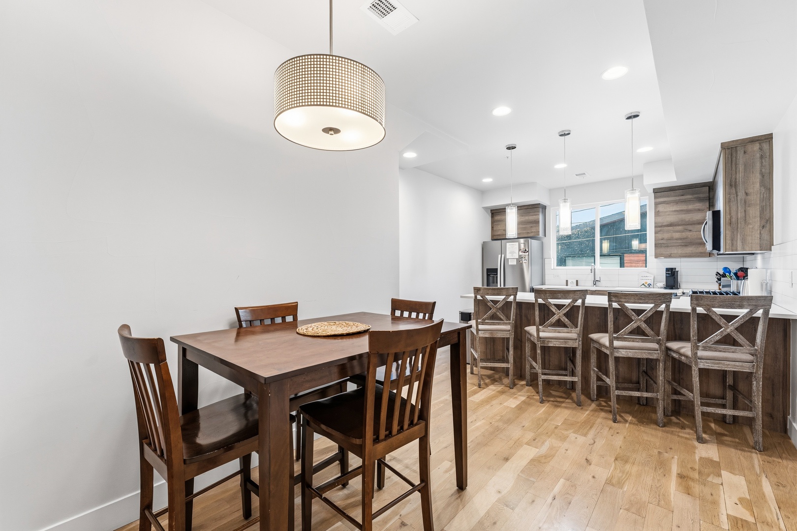 Gather around the table or pull up a stool at the breakfast bar in this bright, modern kitchen—perfect for morning coffee or planning your day's adventure together.