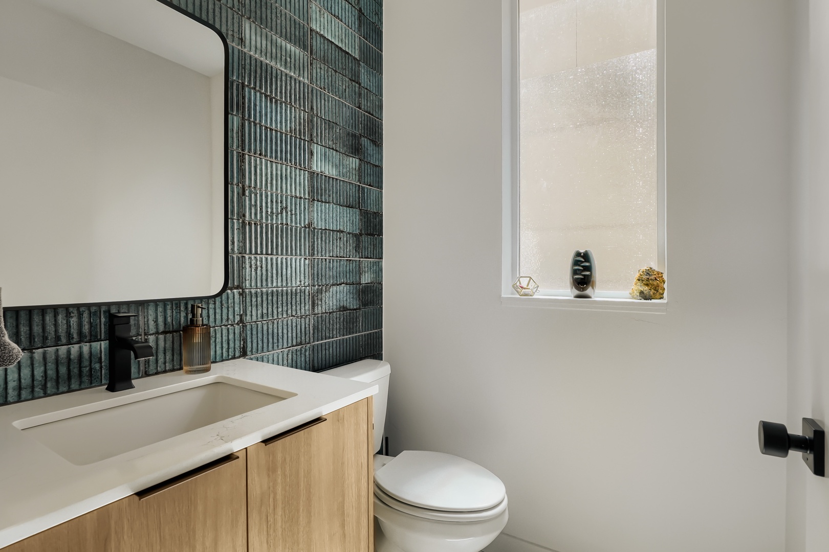 Refresh in your beautifully designed bathroom featuring sleek tiling and modern fixtures—a serene spot to start or end your day.