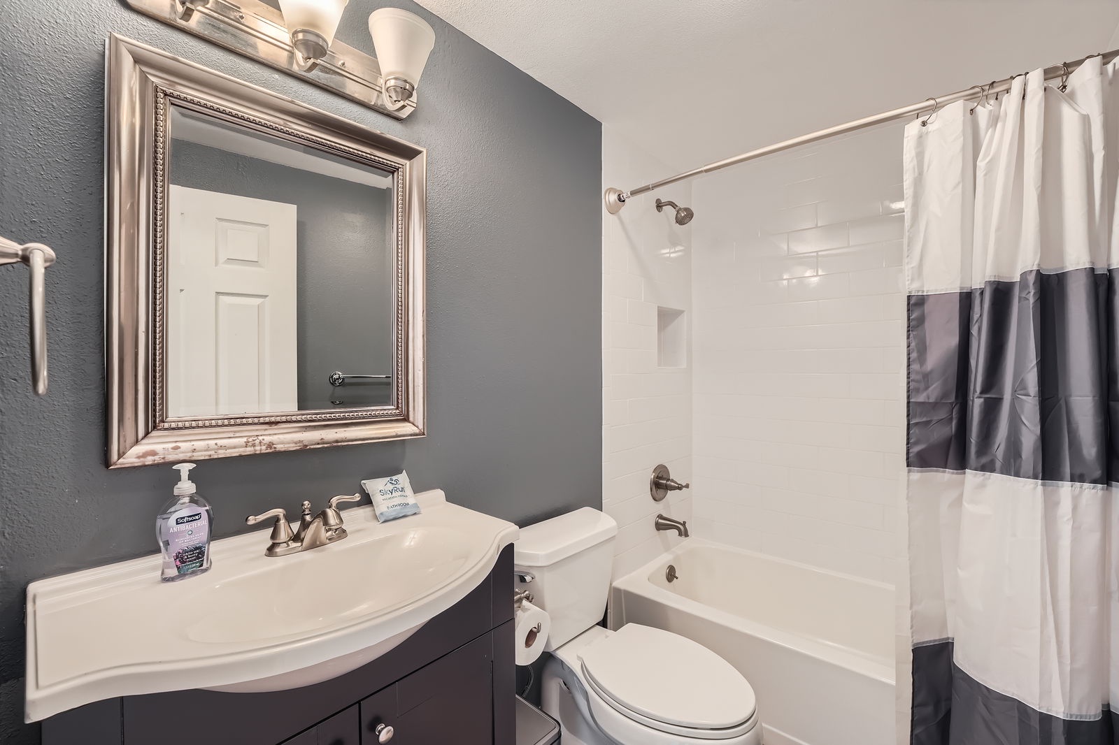 Freshen up in your stylish bathroom with modern finishes and a relaxing tub-shower combo.