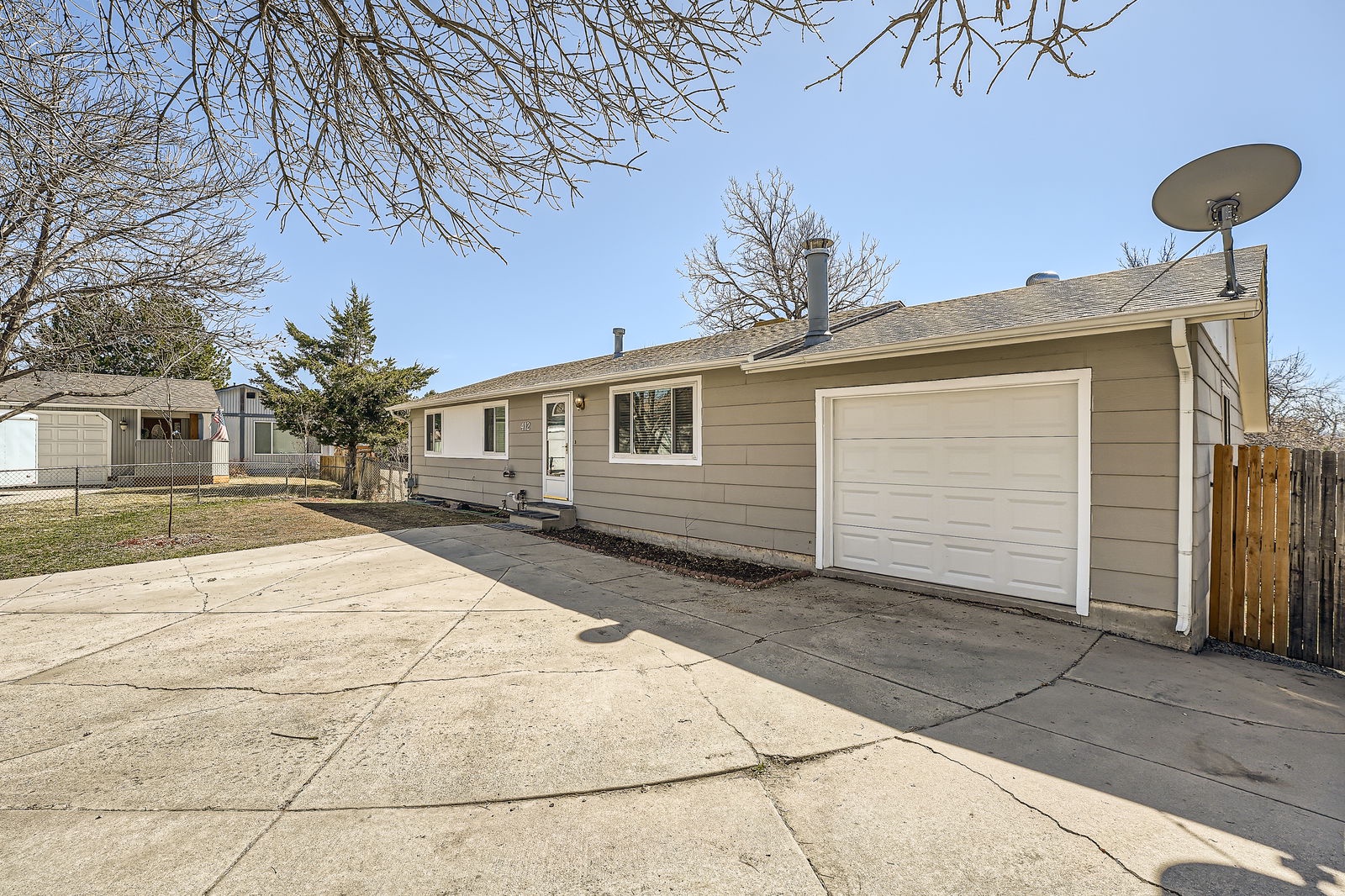 Comfortable ranch-style home with convenient garage parking and peaceful residential setting.