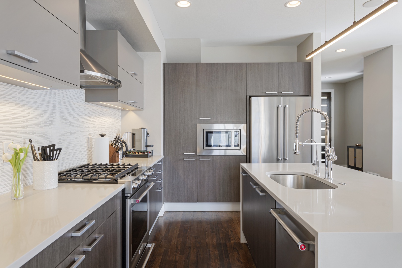 Your sleek modern kitchen features professional-grade appliances, spacious counters, and everything needed to create memorable meals during your stay.
