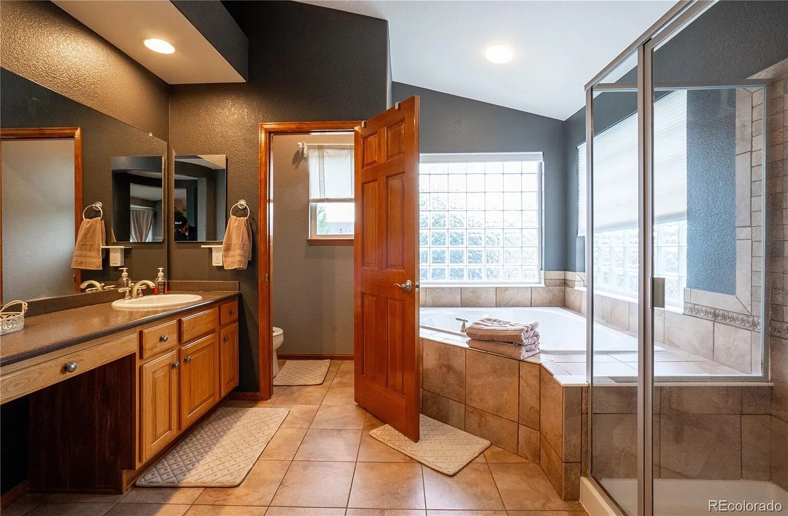 Unwind in your private spa-like bathroom, complete with soaking tub and spacious shower for ultimate relaxation.