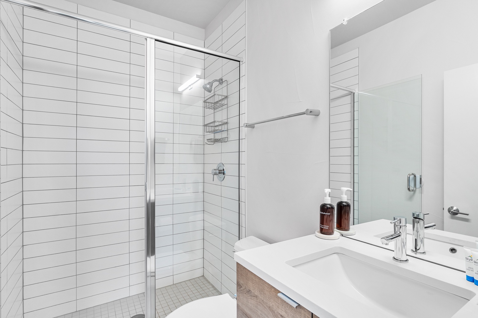 Freshen up in your bright, spotless bathroom with a spacious walk-in shower and modern finishes designed for your comfort.