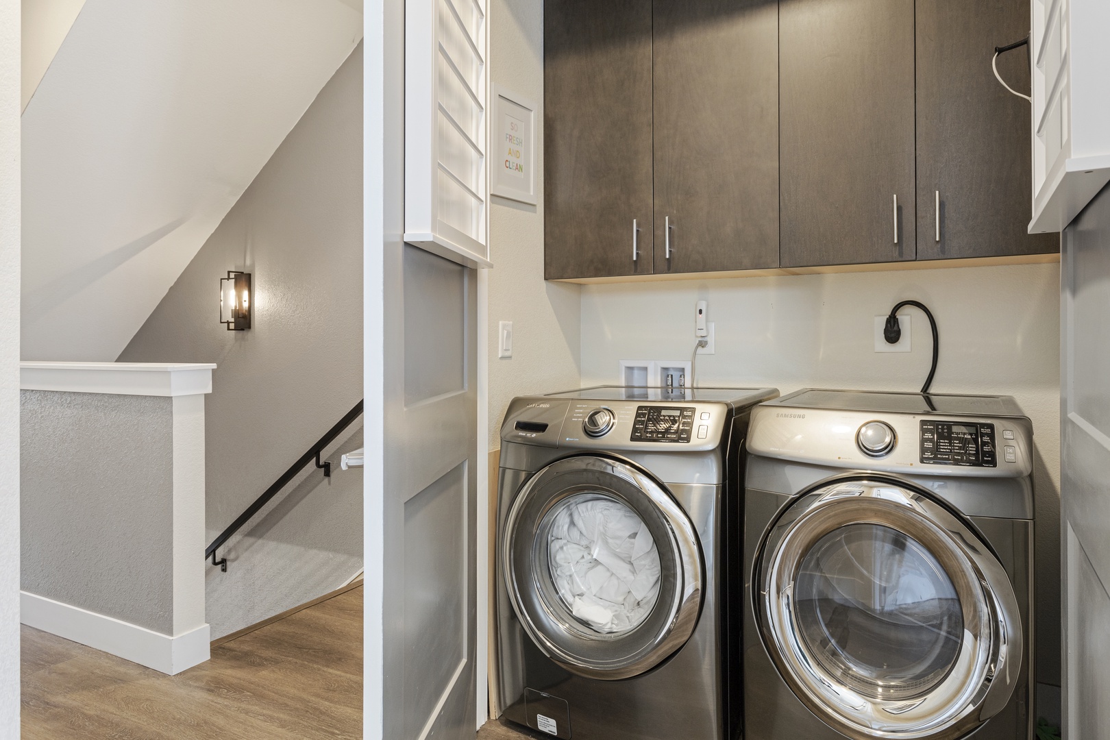 Your dedicated laundry nook makes vacation life effortless with full-size washer and dryer tucked beneath the stairs.
