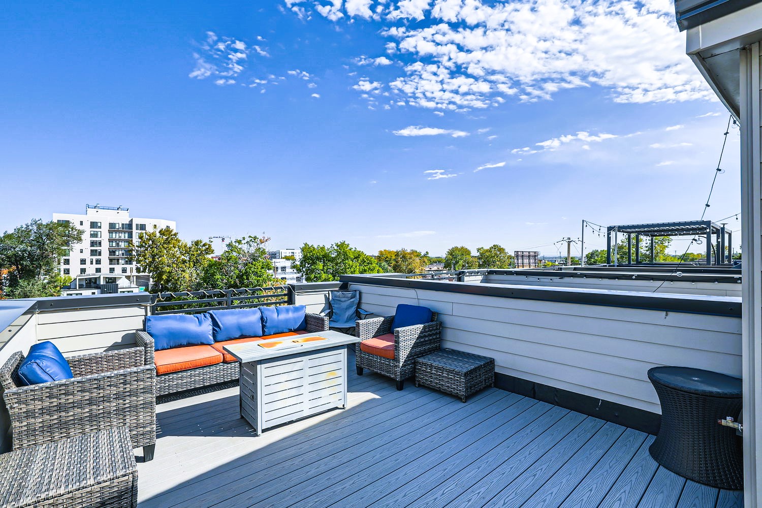 Step onto your private rooftop terrace where plush seating and city views create the perfect retreat for morning coffee or evening relaxation.