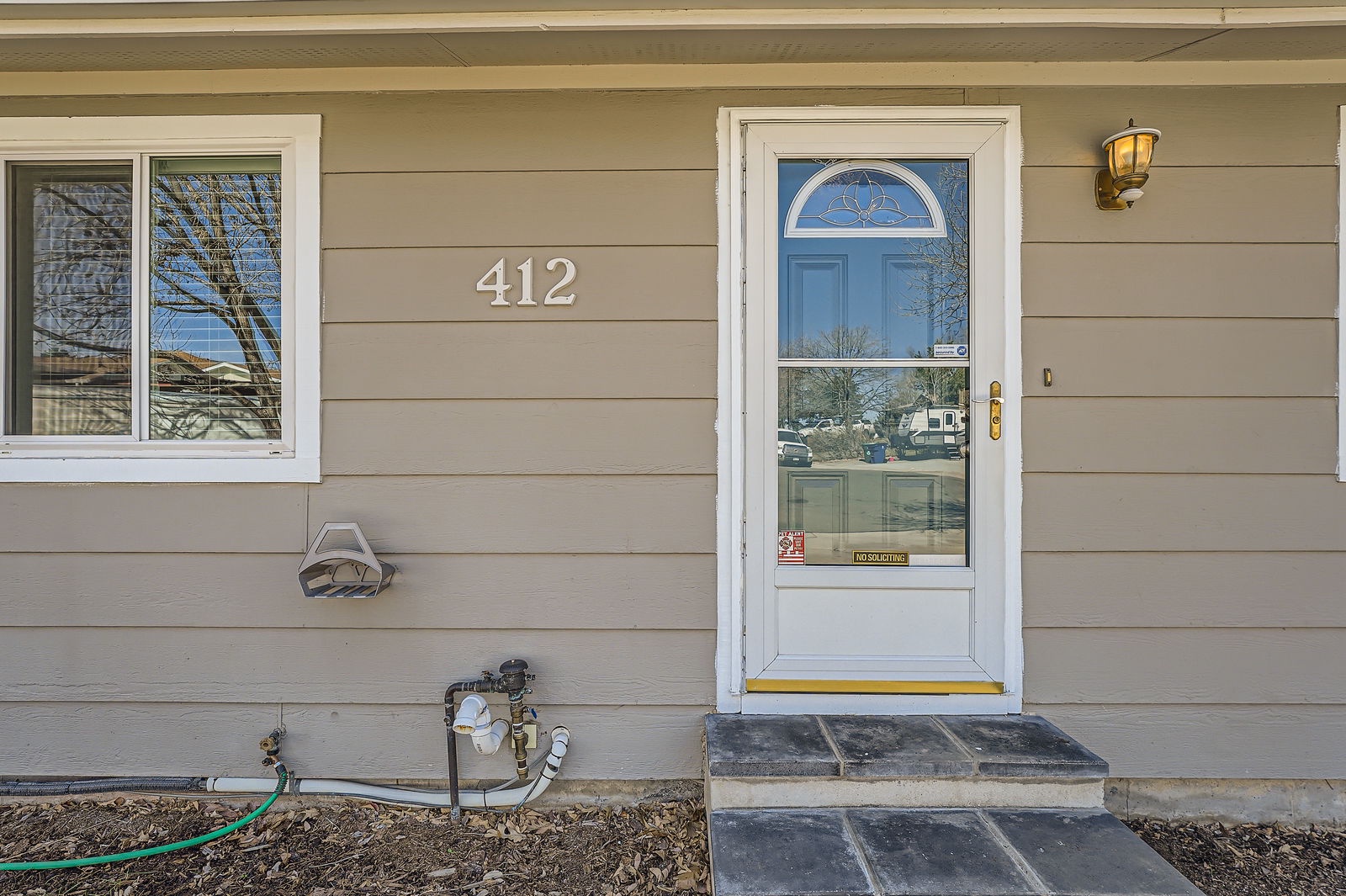 Welcome to your home away from home at 412, featuring a charming entrance with classic details and convenient amenities.
