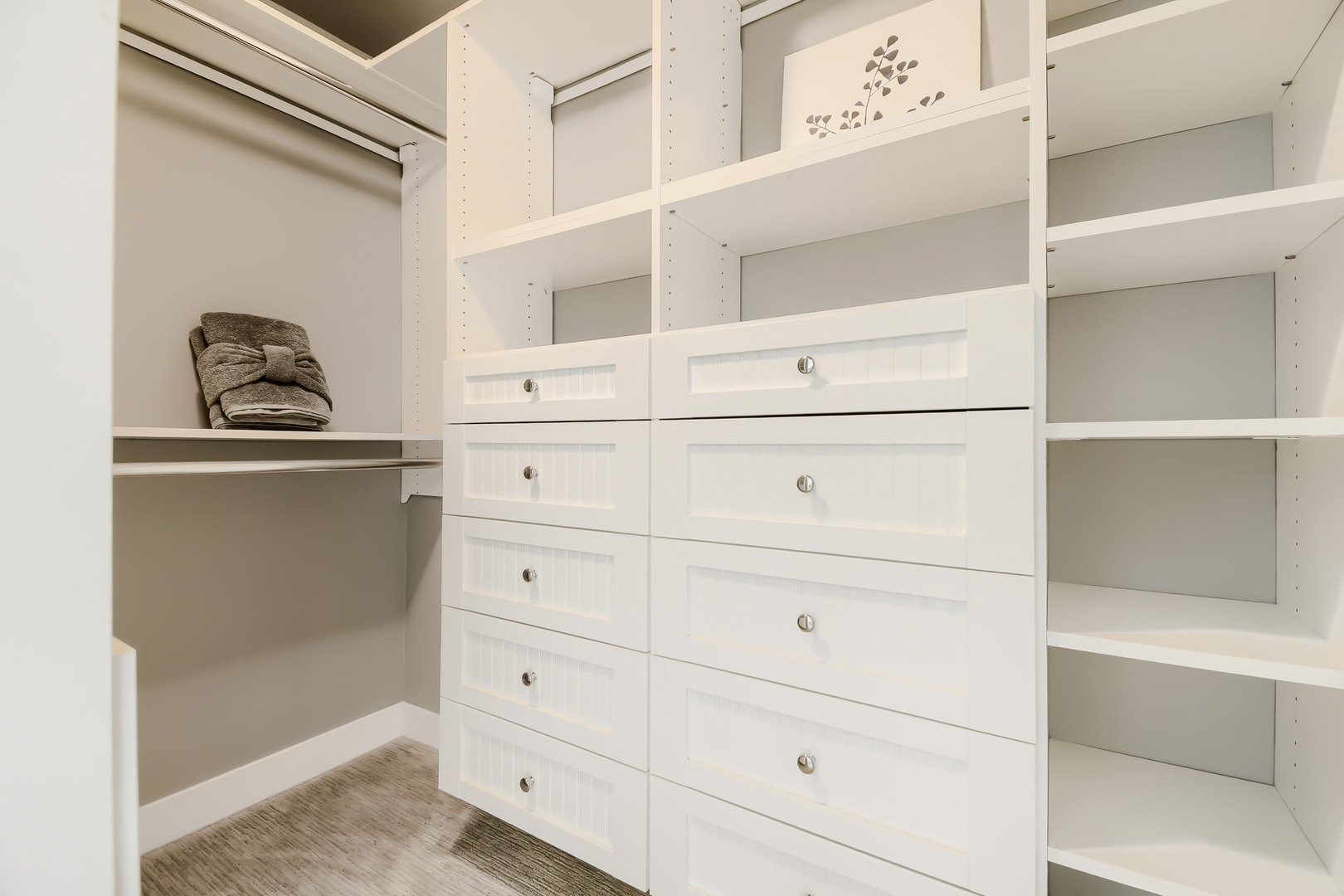 Your personal walk-in closet offers ample shelving and built-in drawers, giving you plenty of space to unpack and settle in comfortably during your stay.