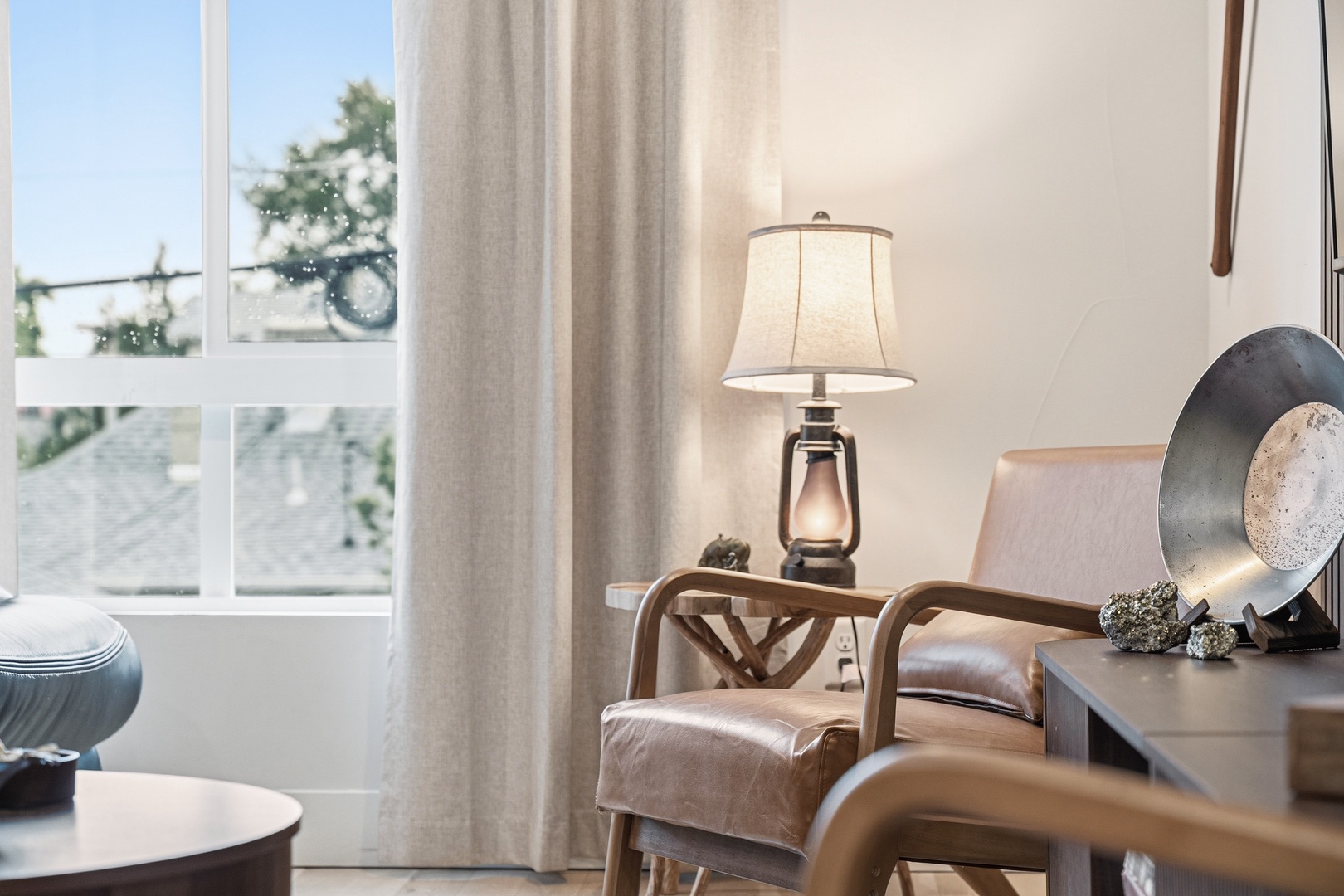 Settle into your cozy seating nook with natural light streaming through large windows, perfect for morning coffee or unwinding with a good book.