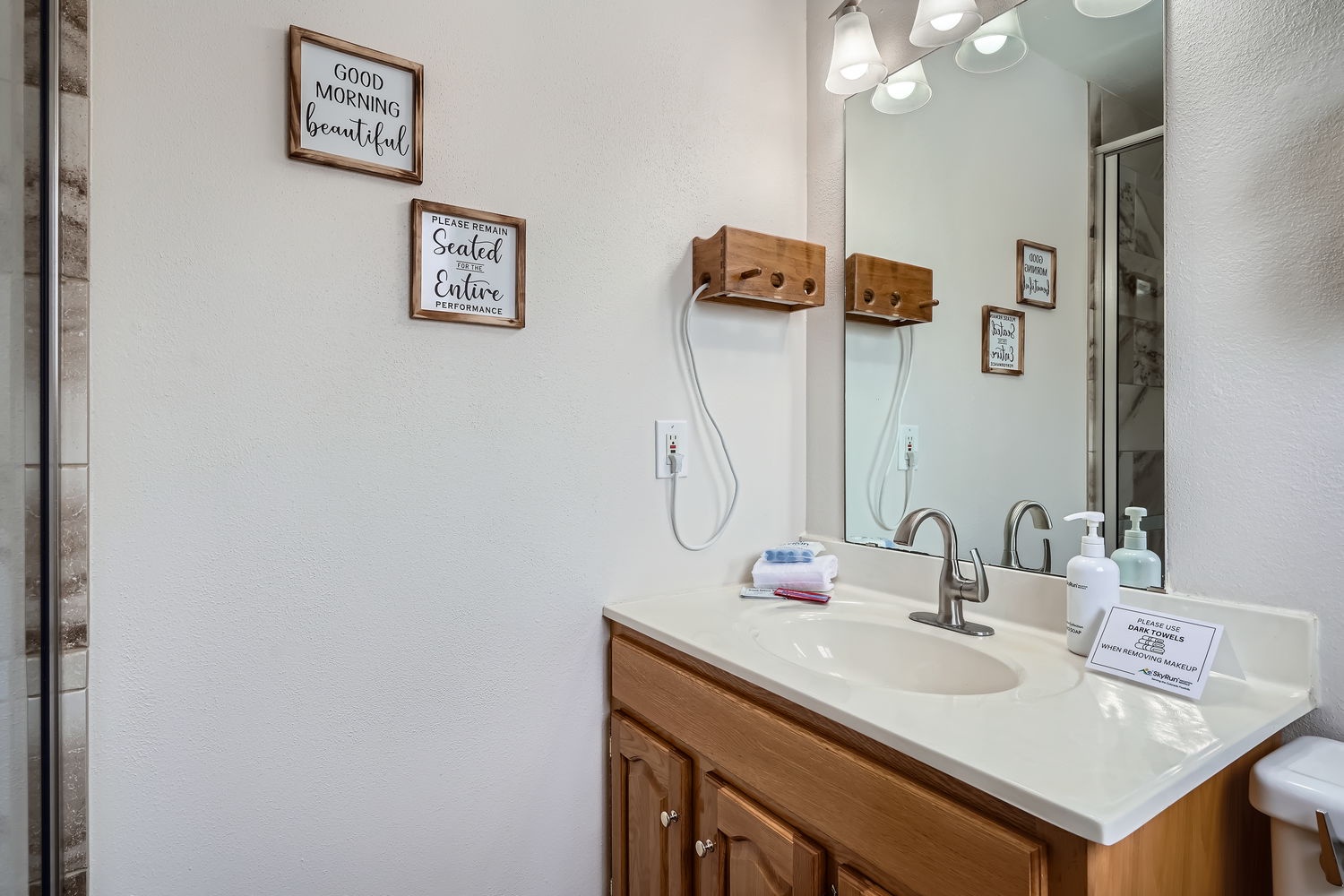 Start your mornings in this bright, welcoming bathroom with a spacious vanity and thoughtful touches that help you feel right at home.