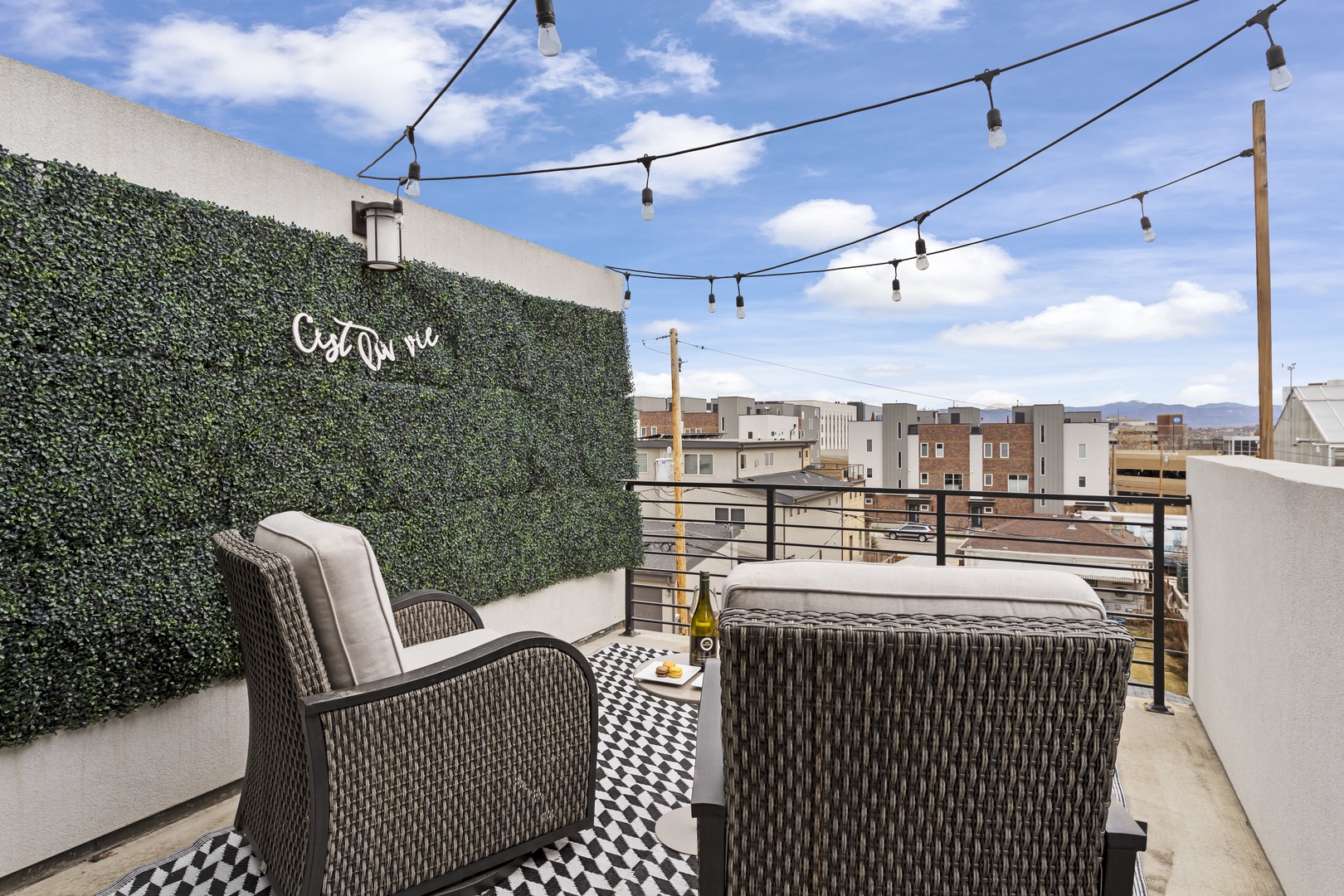 Your private rooftop oasis features comfy seating, twinkling lights, and panoramic city views—perfect for morning coffee or evening wine.