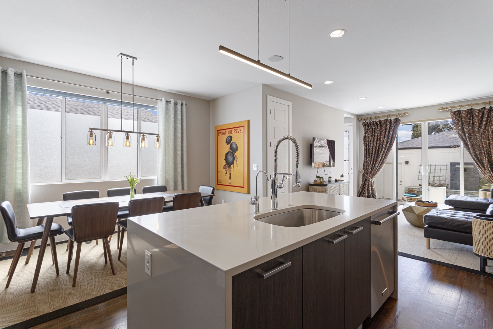 You'll love preparing meals in this sleek kitchen island while chatting with guests in the open dining and living spaces.