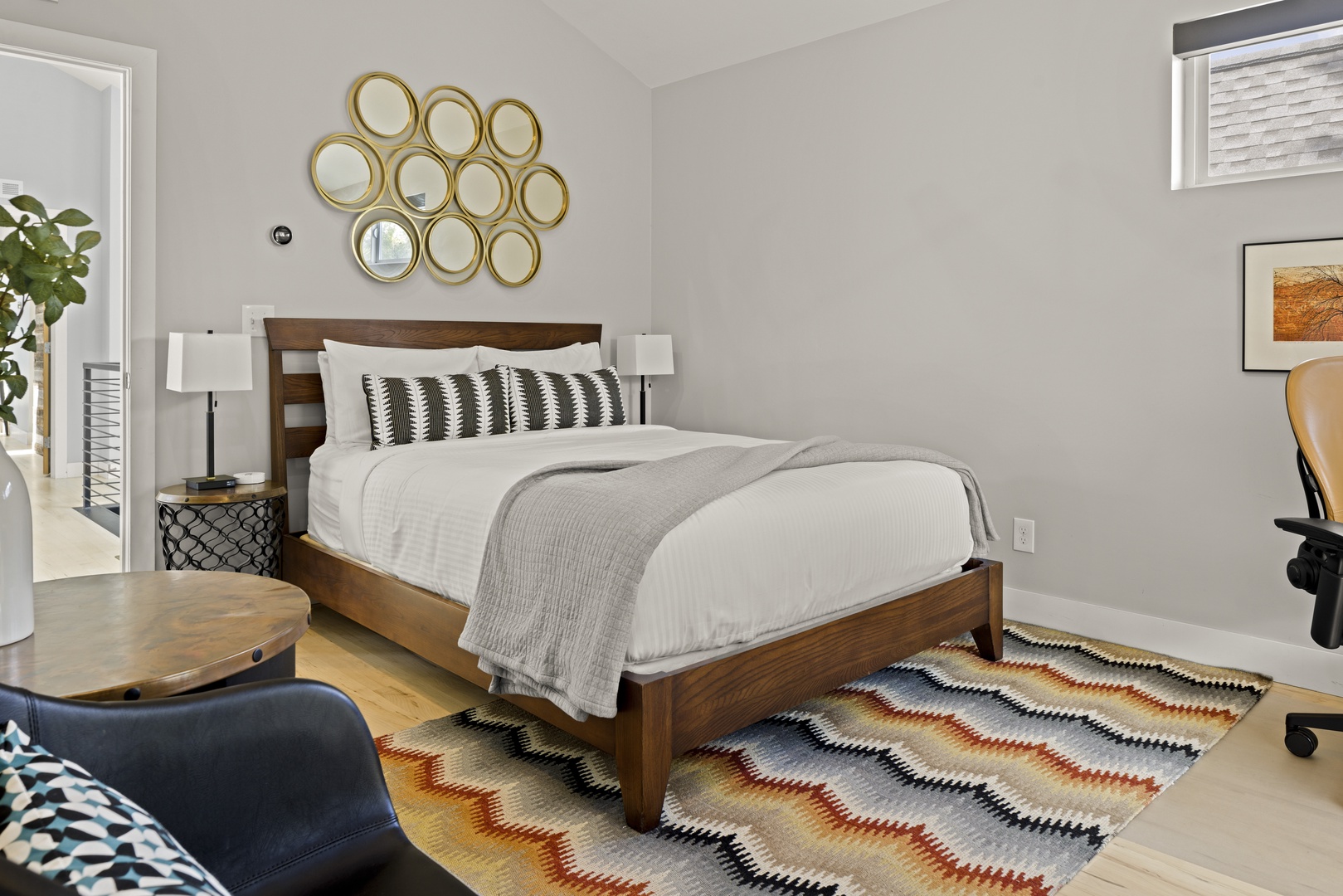 Sink into this cozy bedroom where crisp linens and modern decor create your perfect retreat after exploring the city.