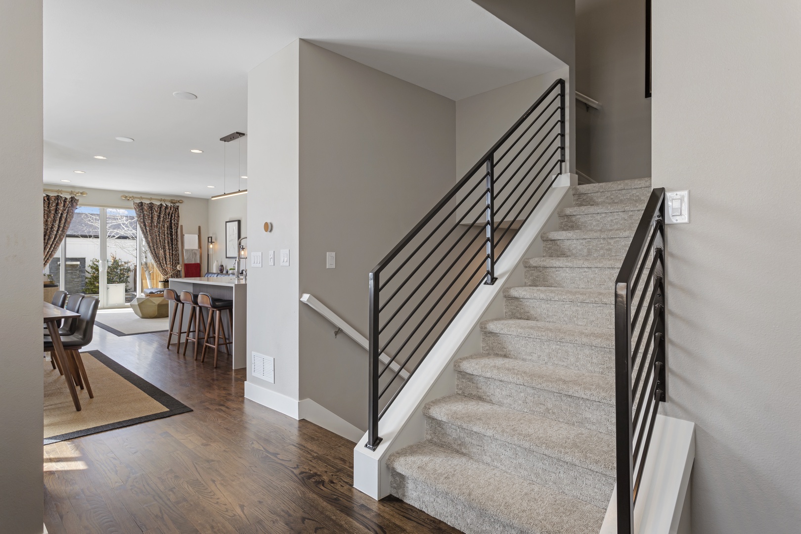 Your modern multi-level home features sleek stairs connecting bright, open living spaces designed for comfort and style.