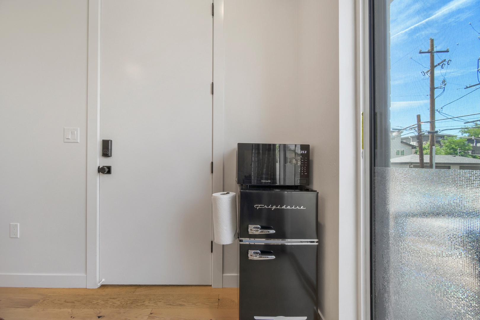 Your modern kitchen essentials await—a sleek mini fridge and microwave ready for quick meals and snacks during your stay.