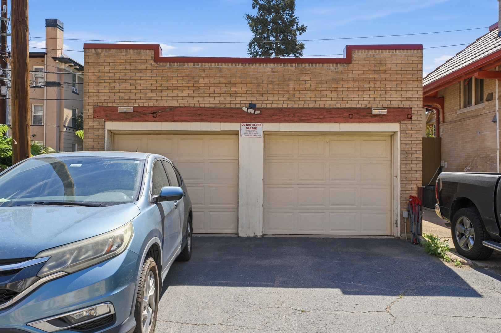 The property features a secure two-car garage with convenient street-level access and dedicated parking spaces for guest use during the stay.