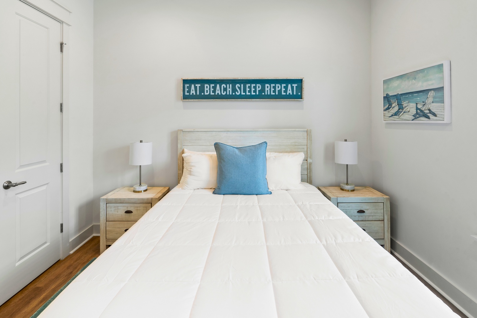 Drift off in this peaceful bedroom where coastal charm meets comfort—your beach getaway dreams begin here.