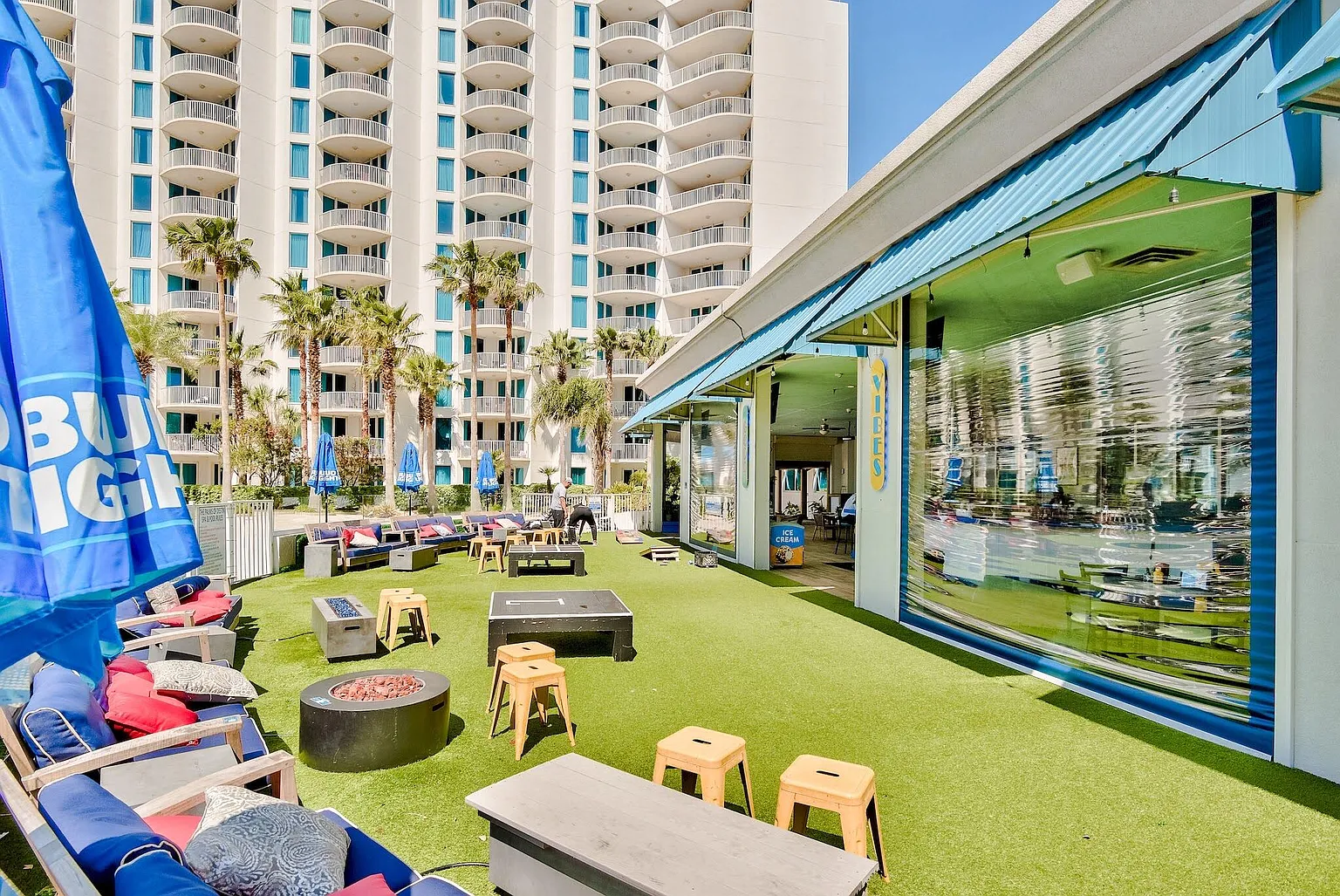 Gather around the fire pit for evening conversations on this vibrant rooftop terrace with games and relaxation zones.