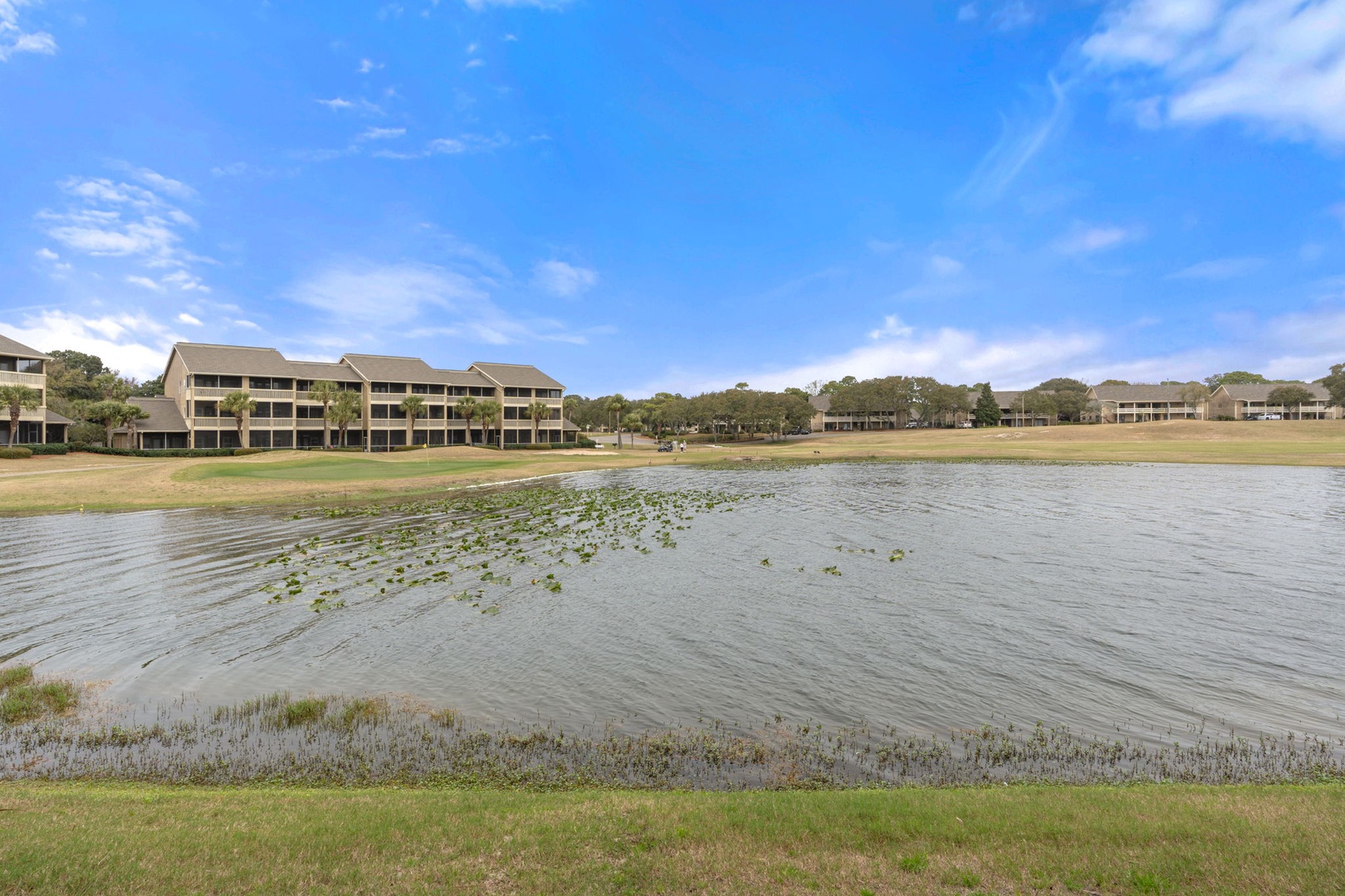 Enjoy morning coffee and evening breezes on this peaceful screened porch. Surrounded by lush greenery, it’s the perfect spot to relax, dine, and unwind after a sun-soaked beach day.